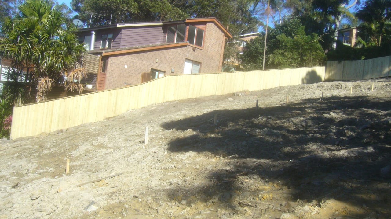 Treated pine timber fence enclosing a freshly cleared and levelled block in Sydney